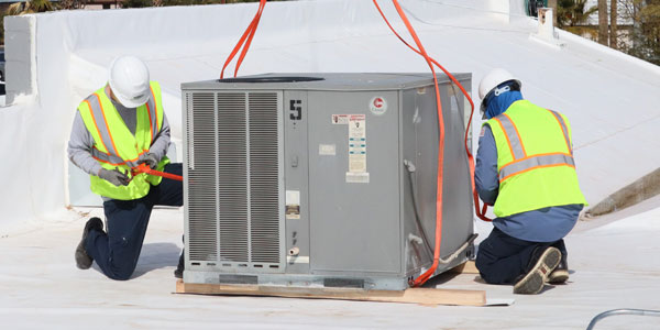 Ultra Air technicians installing an HVAC unit in Tucson